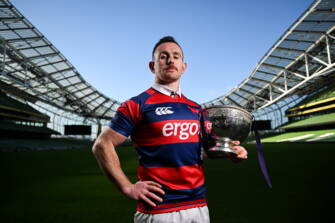 Clontarf captain Dylan Donnellan with the Division 1A trophy