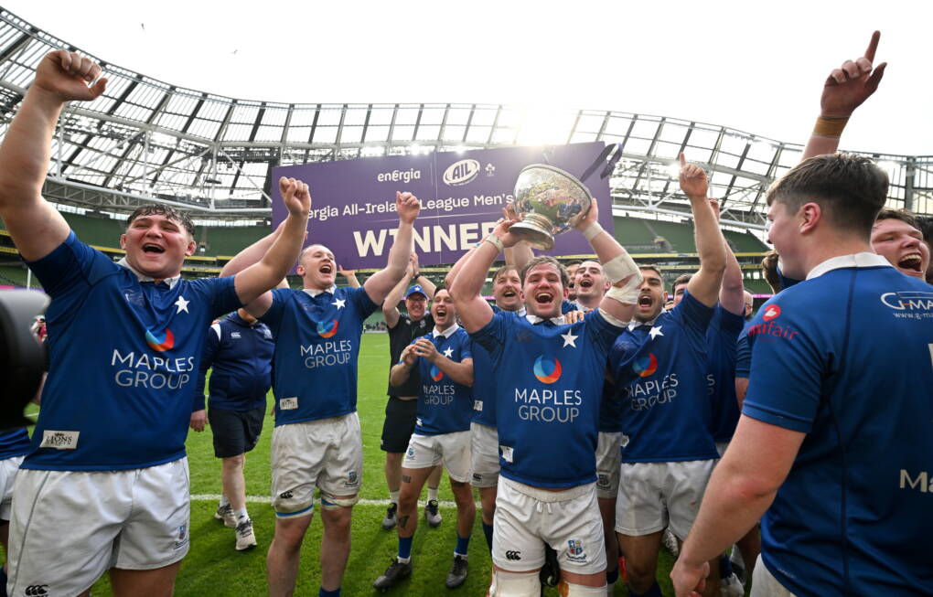 Ethan Baxter holds the trophy aloft as the St. Mary's players celebrate