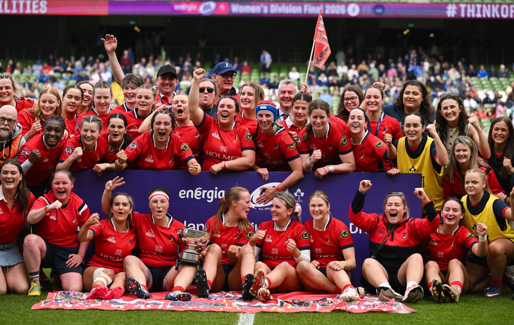 The UL Bohemian players and coaches celebrate with the league trophy