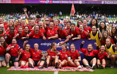 The UL Bohemian players and coaches celebrate with the league trophy