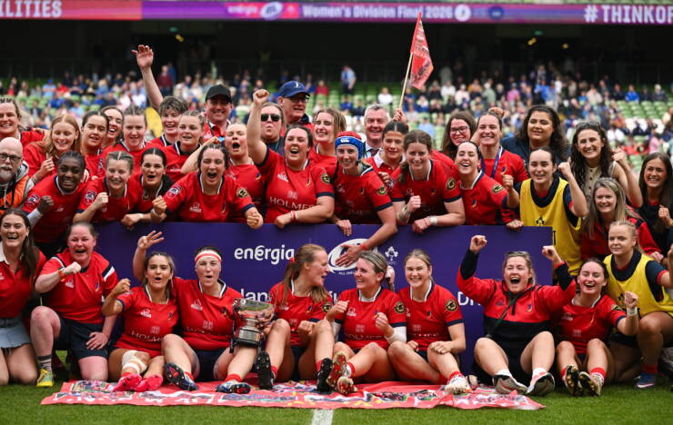 The UL Bohemian players and coaches celebrate with the league trophy